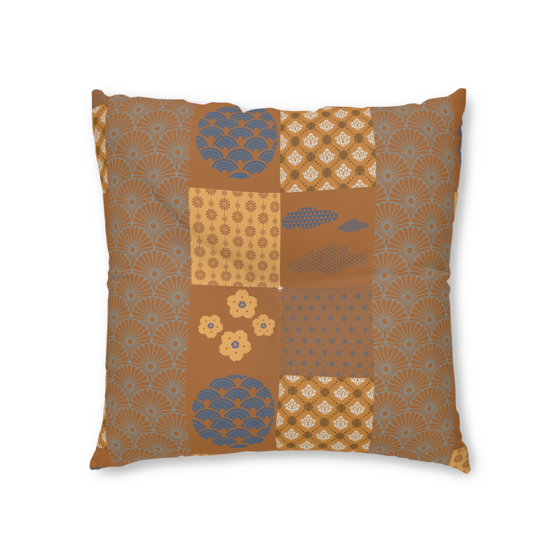A square decorative throw pillow featuring a patchwork design of traditional Japanese-inspired patterns in warm brown, beige, and muted blue-gray, shown against a plain white background.