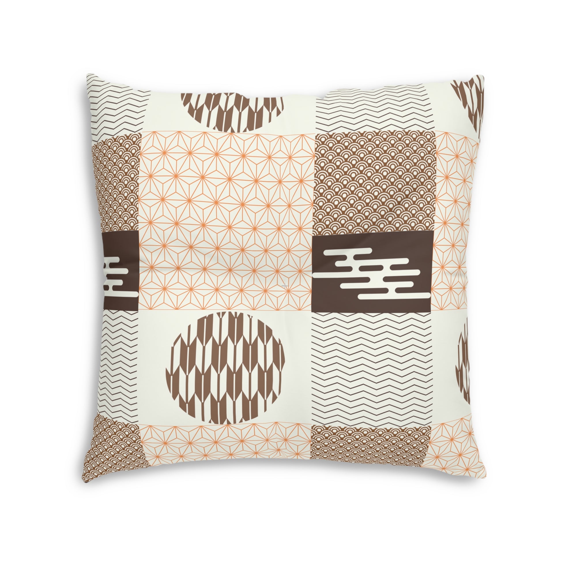A square decorative throw pillow featuring a patchwork design of geometric and Japanese-inspired patterns in brown, beige, and orange on an off-white background.