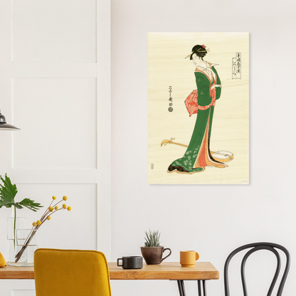 Poster of a woman in traditional attire on a wall above a table with decor items.