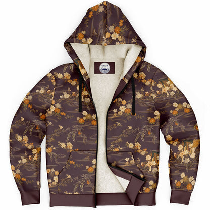 A brown zip-up hoodie with a beige and orange floral pattern, featuring a cream-colored fleece lining and black drawstrings, shown against a plain white background.