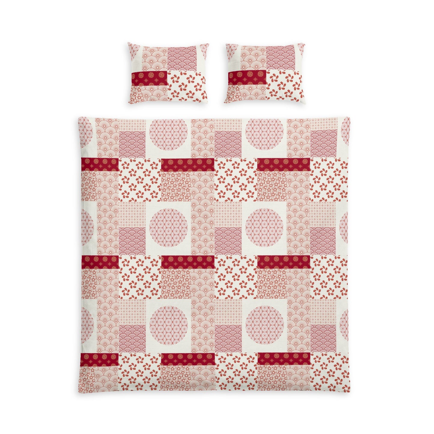 A bedding set featuring a patchwork quilt and two matching pillowcases with a geometric and floral patchwork pattern in shades of pink, red, and white.