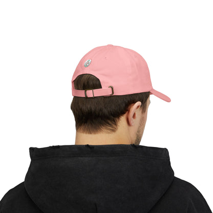 Person wearing a pink cap with a brand logo on a white background