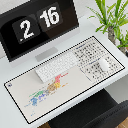 Desk setup with a large mouse pad featuring a map design, keyboard, and digital clock.