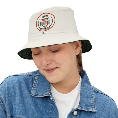 Person wearing a white bucket hat with a logo on a white background