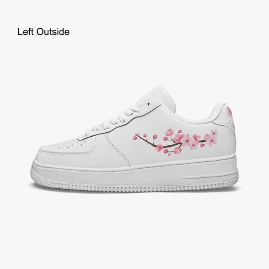 White sneaker with pink floral design on a white background