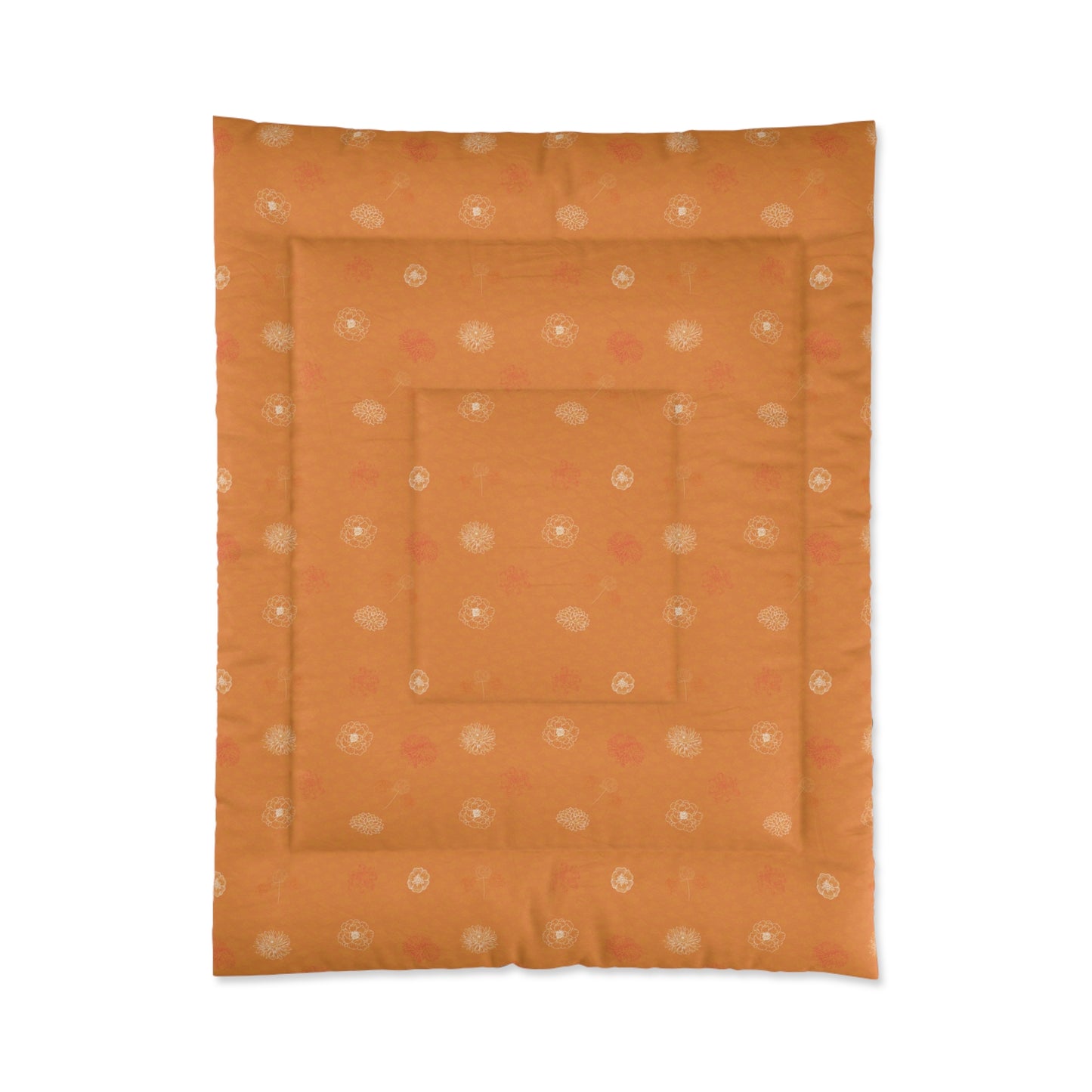 An orange quilted comforter or mattress protector featuring a repeating pattern of small white and pink floral motifs, shown flat against a white background.