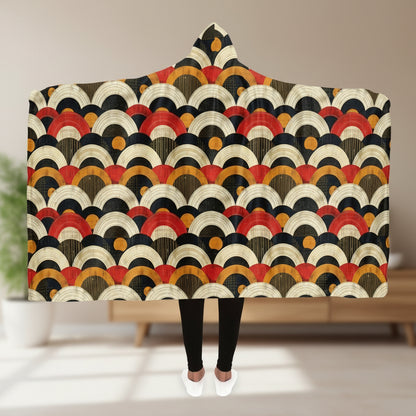 Hooded blanket with a colorful geometric pattern on a white background