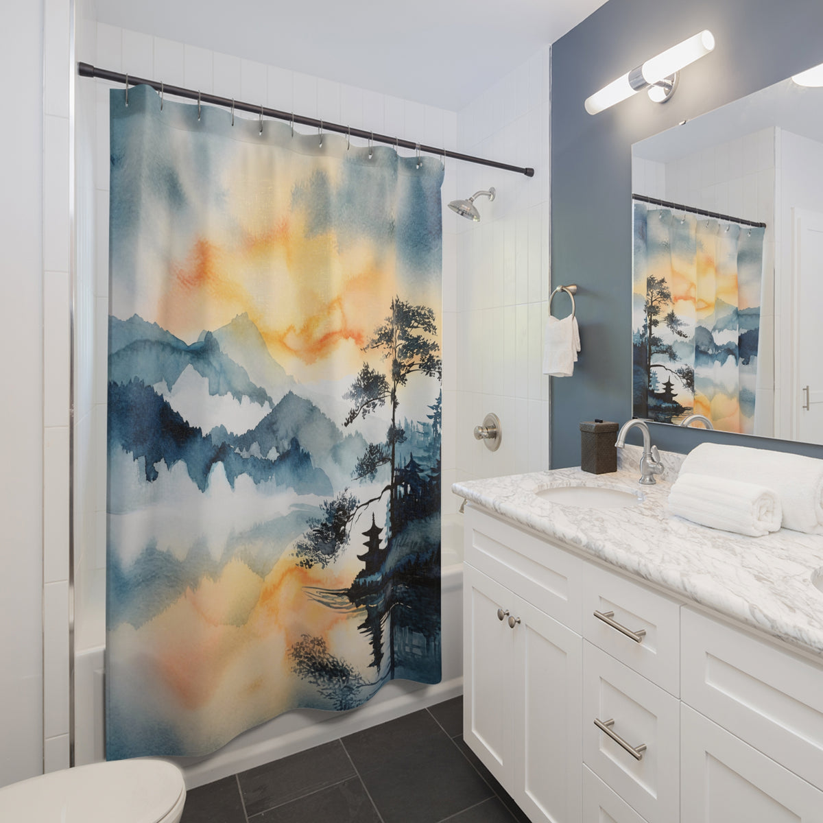 KAITO Japan Design Asahi Reflection Shower Curtain featuring an authentic Sumi-e ink wash mountain landscape rendered in misty blues and warm golden amber, anchored by a dark pine tree and pagoda silhouette reflecting in still water.