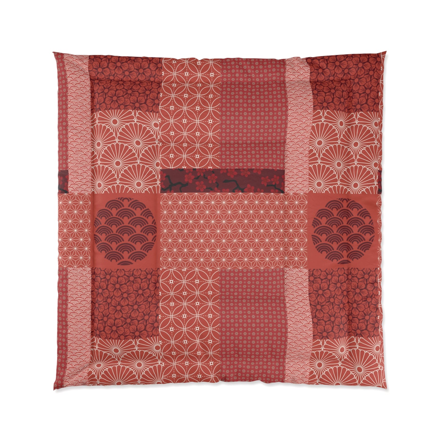 Patchwork quilt with red and white patterns on a white background