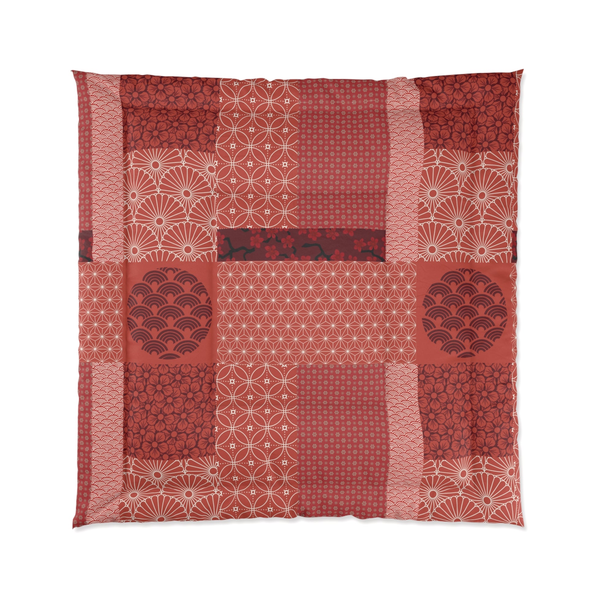 Patchwork quilt with red and white patterns on a white background