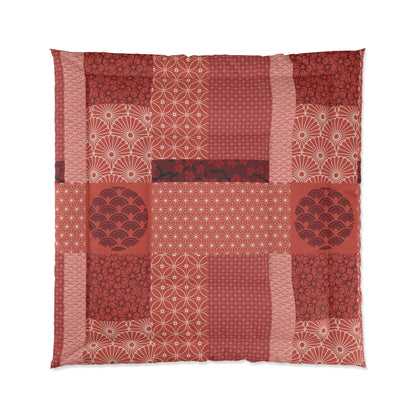 Patchwork quilt with red and white patterns on a white background