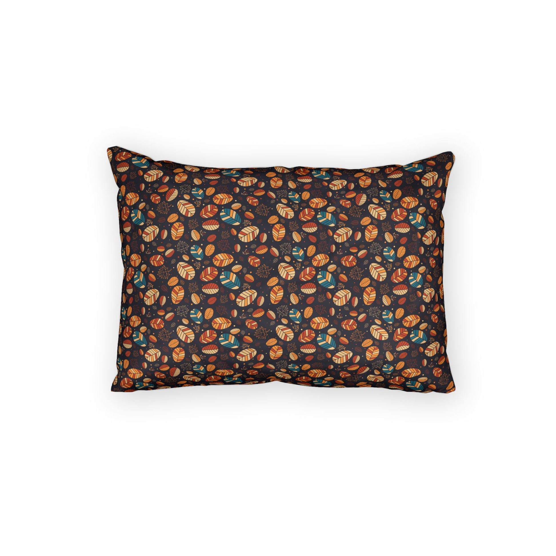 A rectangular throw pillow with a dark background and an all-over pattern of small illustrated pumpkins and acorns in orange, brown, and teal, shown on a plain white background.