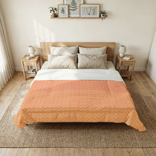 Bedroom with a bed featuring an orange quilt and white bedding, flanked by two nightstands with lamps. Heritage Cotton