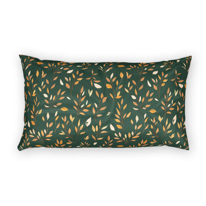 A rectangular lumbar pillow with a dark green background and an all-over pattern of stylized leaves in gold, beige, and white, shown against a plain white background.