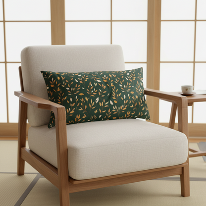 A modern armchair with cream-colored cushions and a light wood frame, styled with a dark green throw pillow featuring a gold leaf pattern, set in a Japanese-style room with shoji screens.