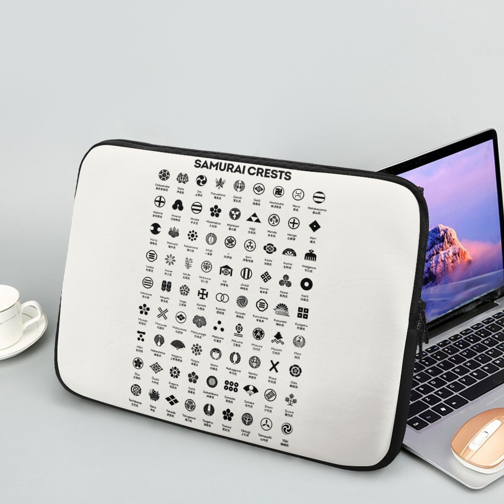 Samurai crests and Hiragana chart printed on a protective laptop sleeve