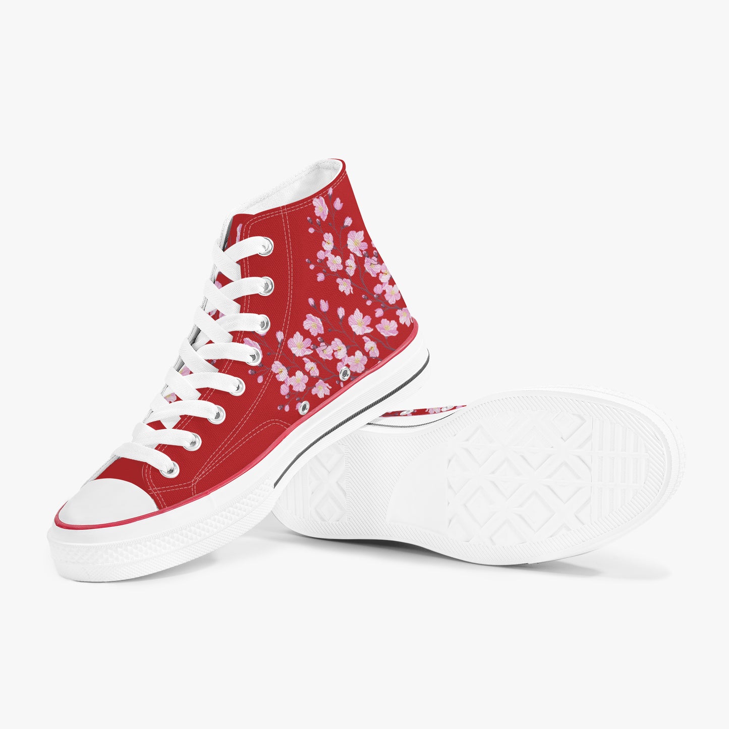 Red high-top sneakers with white floral pattern on a white background