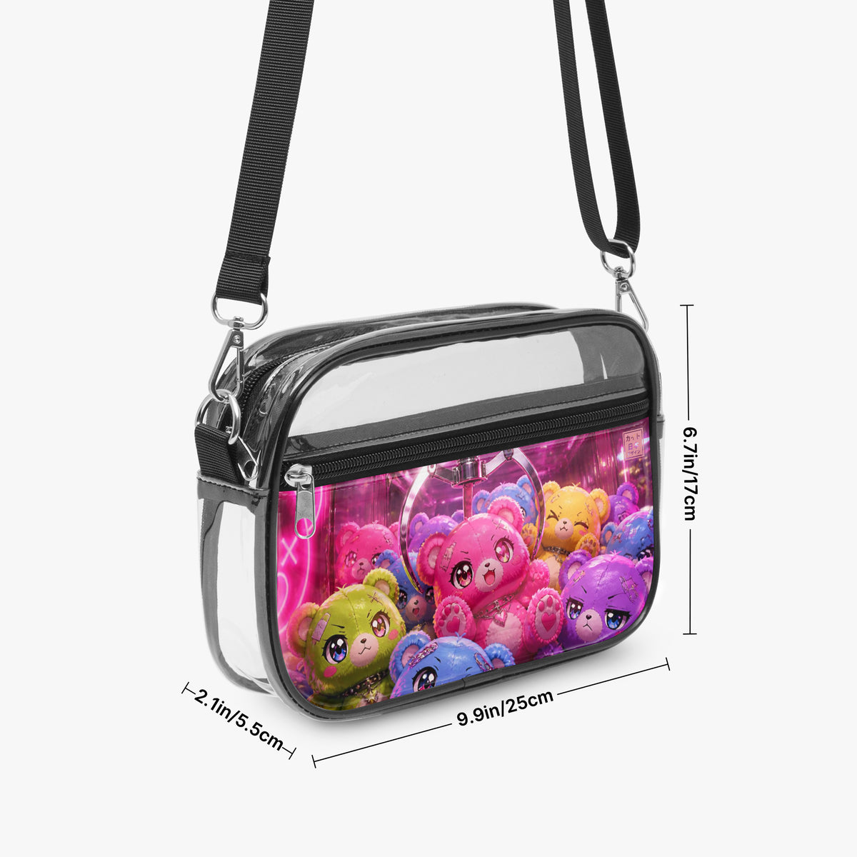 A clear crossbody bag with a colorful cartoon teddy bear print on the front, black straps, and dimension markings showing its measurements against a light gray background.