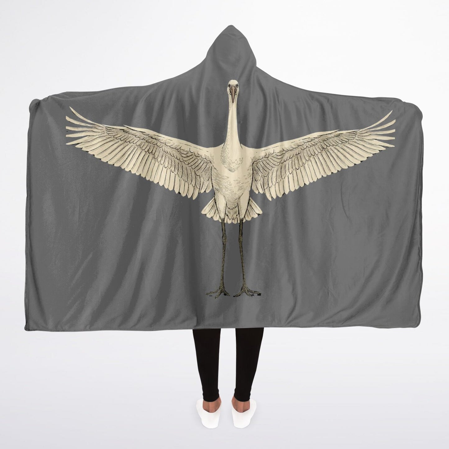 Back view of a grey hooded blanket featuring a large, vintage illustration of a white stork or crane with wings fully spread across the arms.