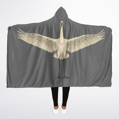 Back view of a grey hooded blanket featuring a large, vintage illustration of a white stork or crane with wings fully spread across the arms.