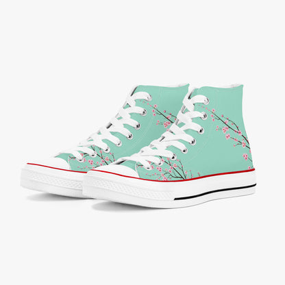 Teal high-top sneakers with floral design on a white background
