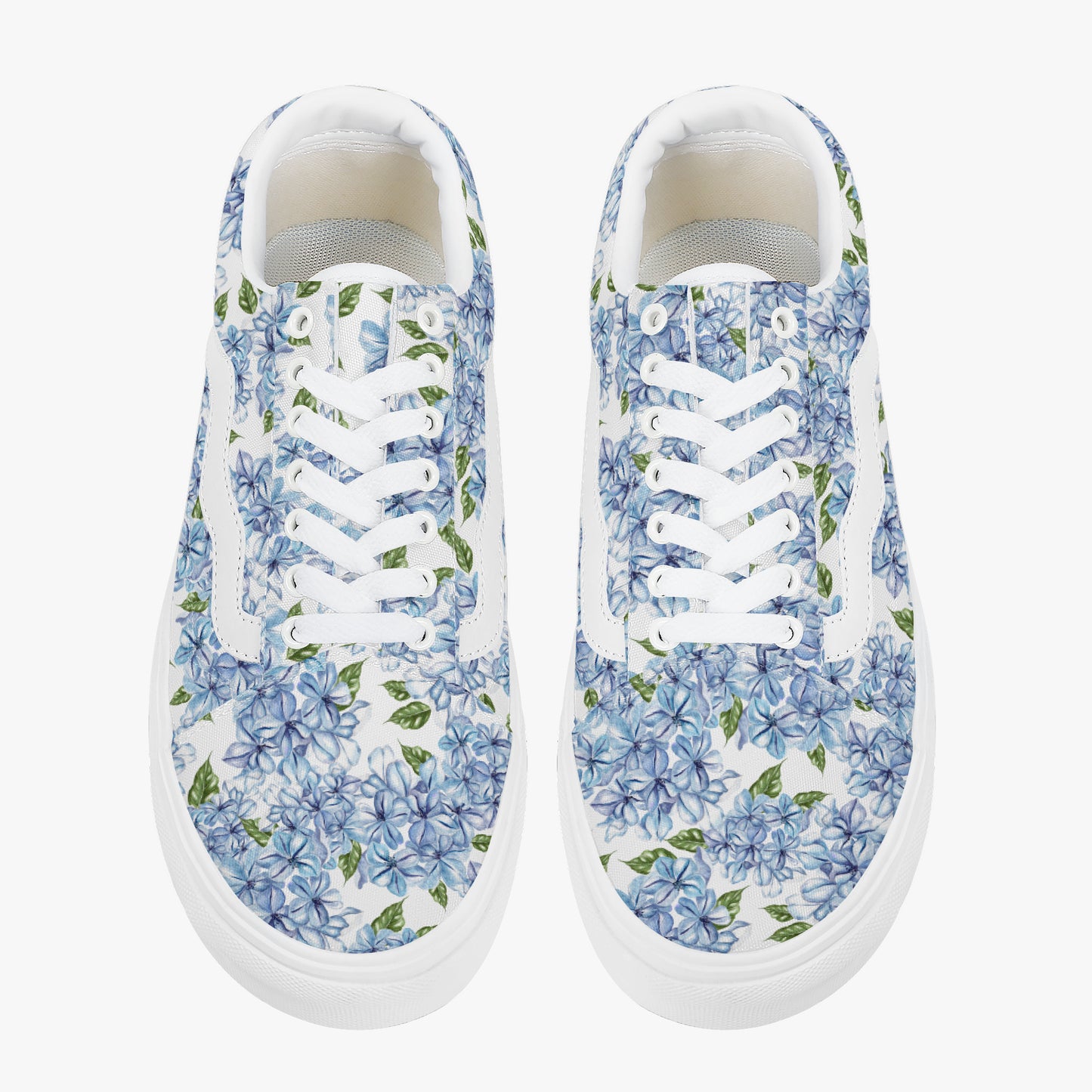 Pair of floral sneakers with blue flowers on a white background