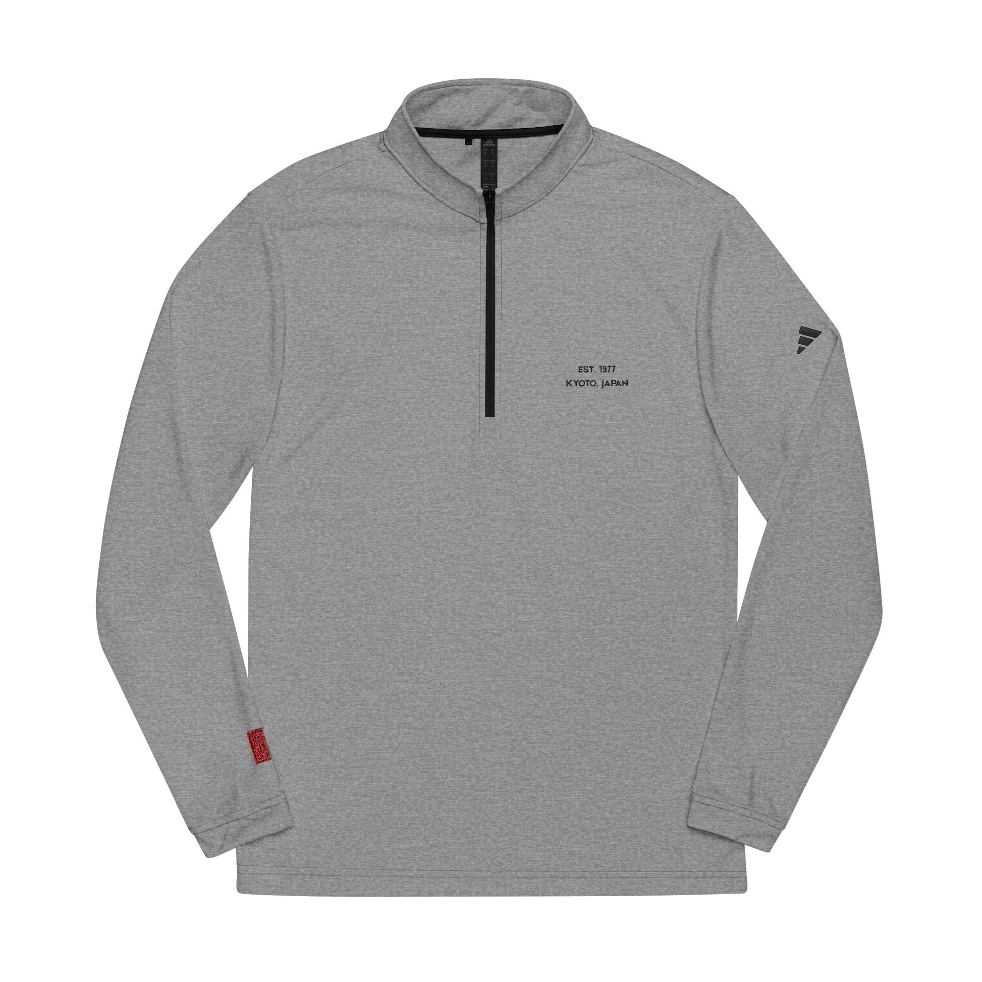 Gray long-sleeve shirt with a brand logo on a white background