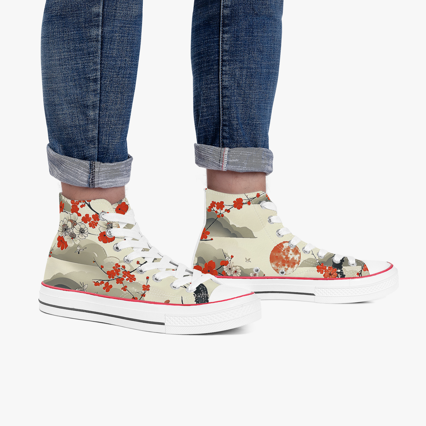 High-top sneakers with floral design worn with rolled-up jeans on a white background