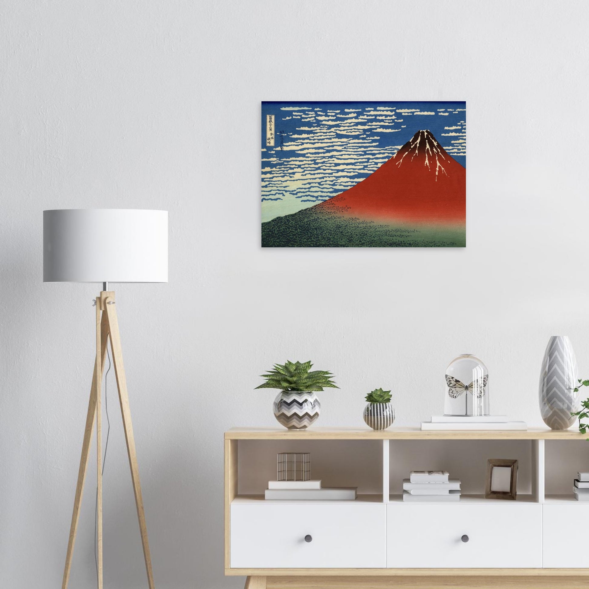 Room interior with a painting of Mount Fuji, a lamp, and a shelf with decorative items.