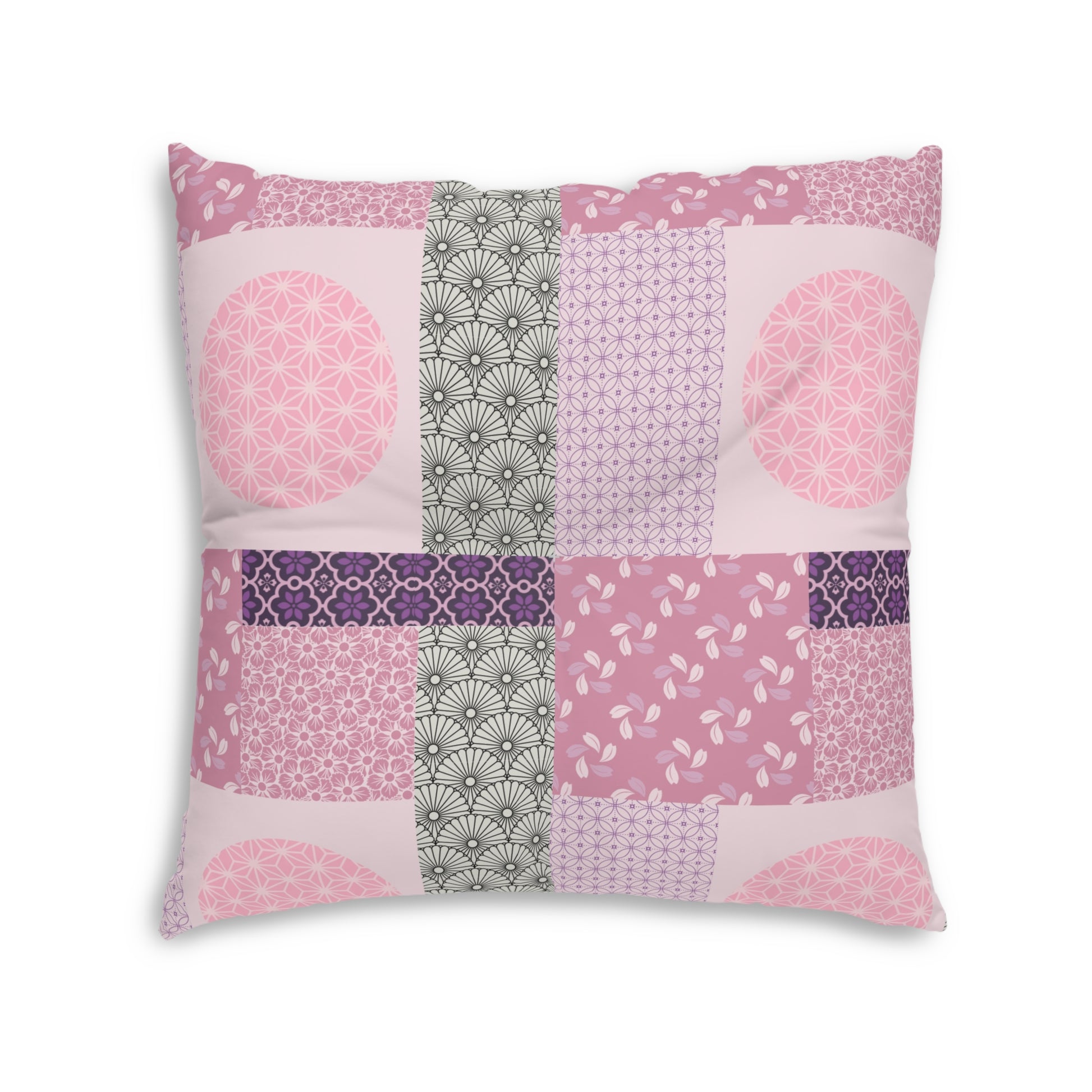 A square decorative throw pillow featuring a patchwork design of various pink, purple, and gray Japanese-inspired patterns, set against a plain white background.