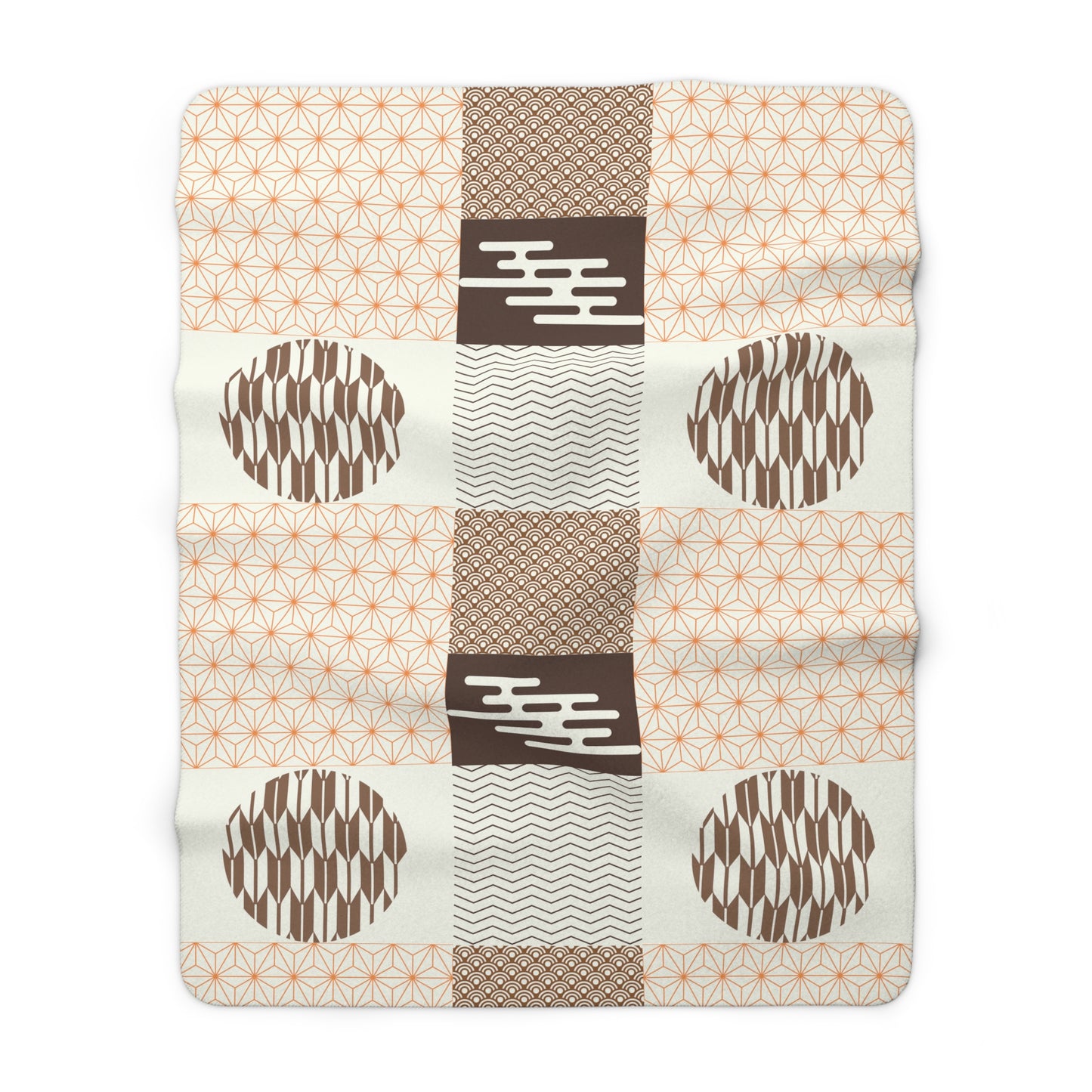 Patchwork blanket with geometric patterns on a white background