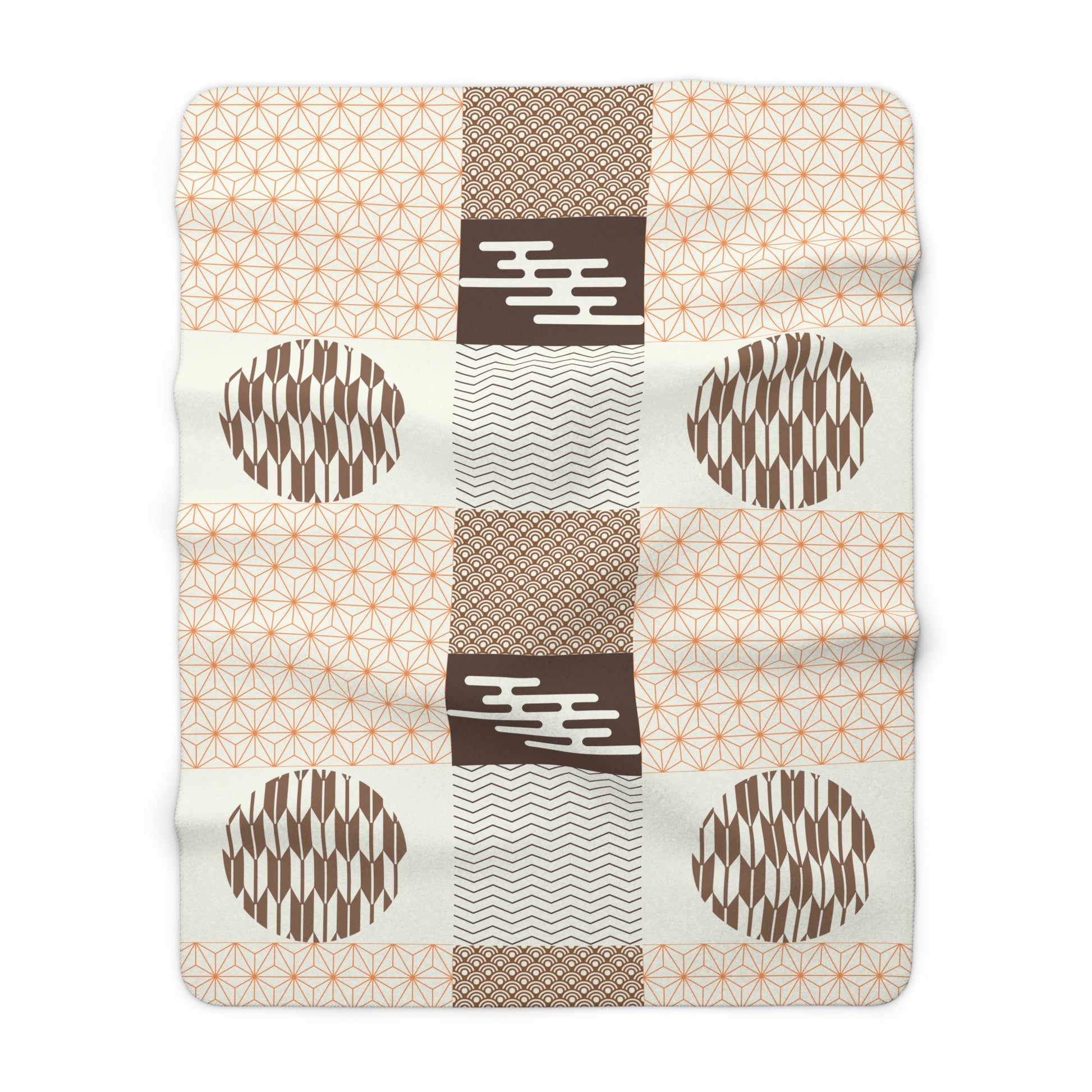 Patchwork blanket with geometric patterns on a white background