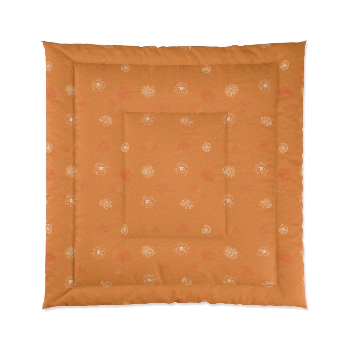 An orange square quilted floor cushion with a decorative border and central inset, featuring a subtle repeating floral pattern in cream and muted pink, shown against a plain white background.