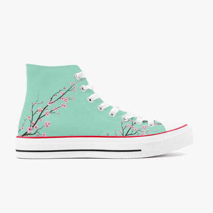 Mint green high-top sneaker with cherry blossom design on a white background