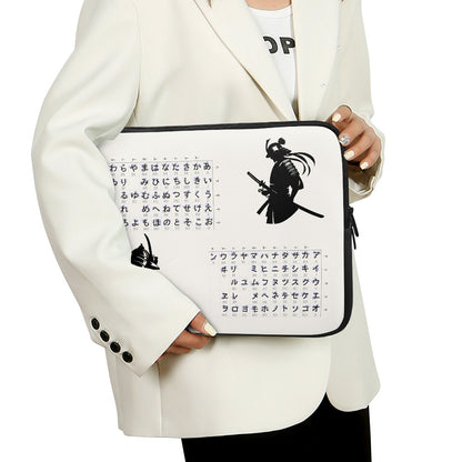 Person holding a laptop case with samurai design and text