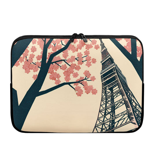 Laptop sleeve with cherry blossom tree and Tokyo Tower design on a white background