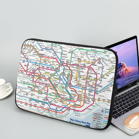 Laptop with a Tokyo subway map design on a gray surface