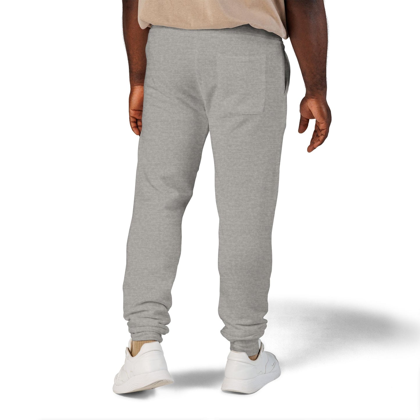 Person wearing gray sweatpants on a white background