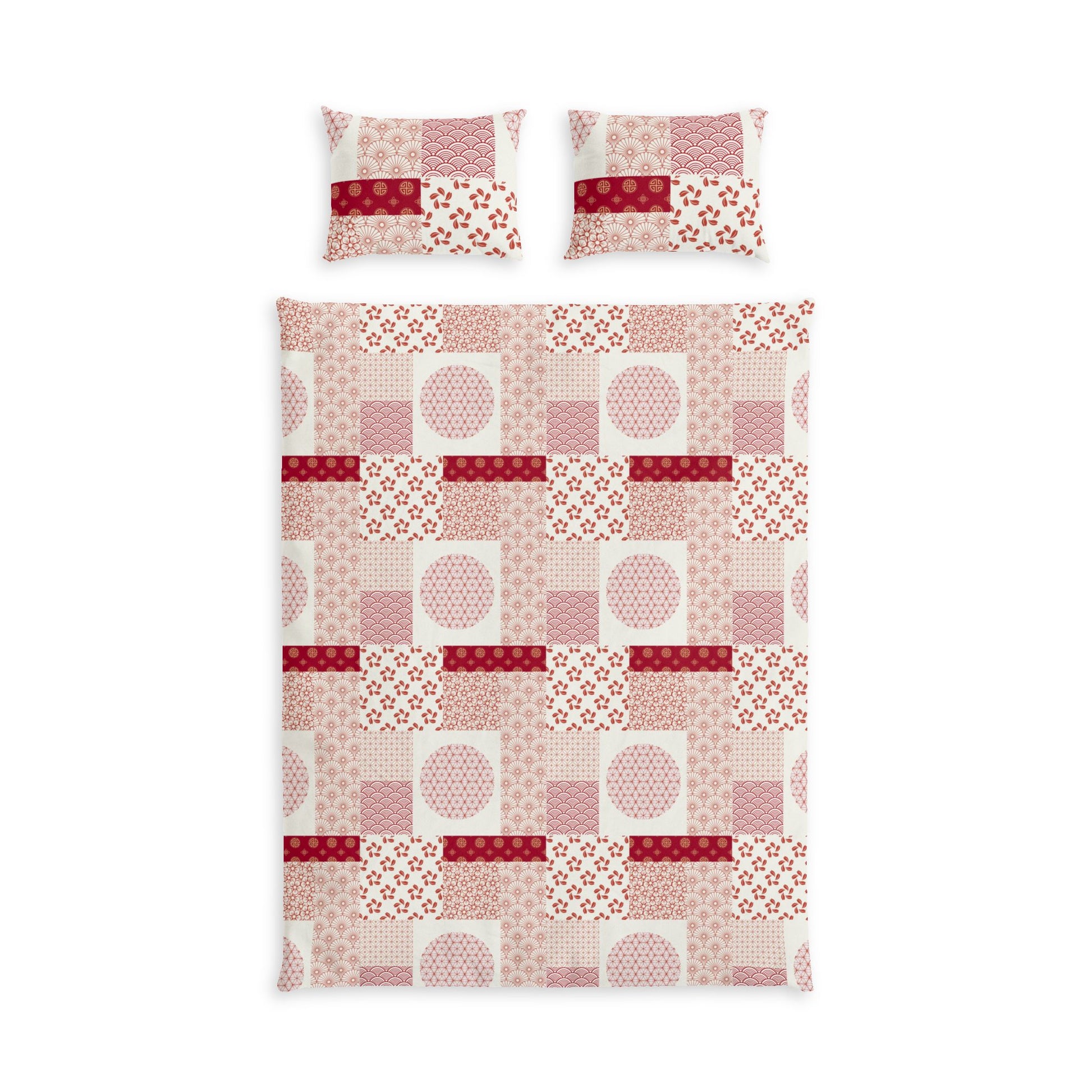 A bedding set featuring a duvet cover and two matching pillowcases with a patchwork quilt pattern in shades of pink, red, and white.