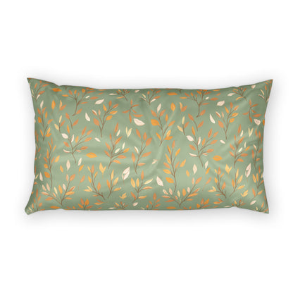 A rectangular lumbar pillow with a sage green background and an all-over botanical pattern of thin branches, leaves, and small berries in muted orange, cream, and olive tones, shown on a plain white background.