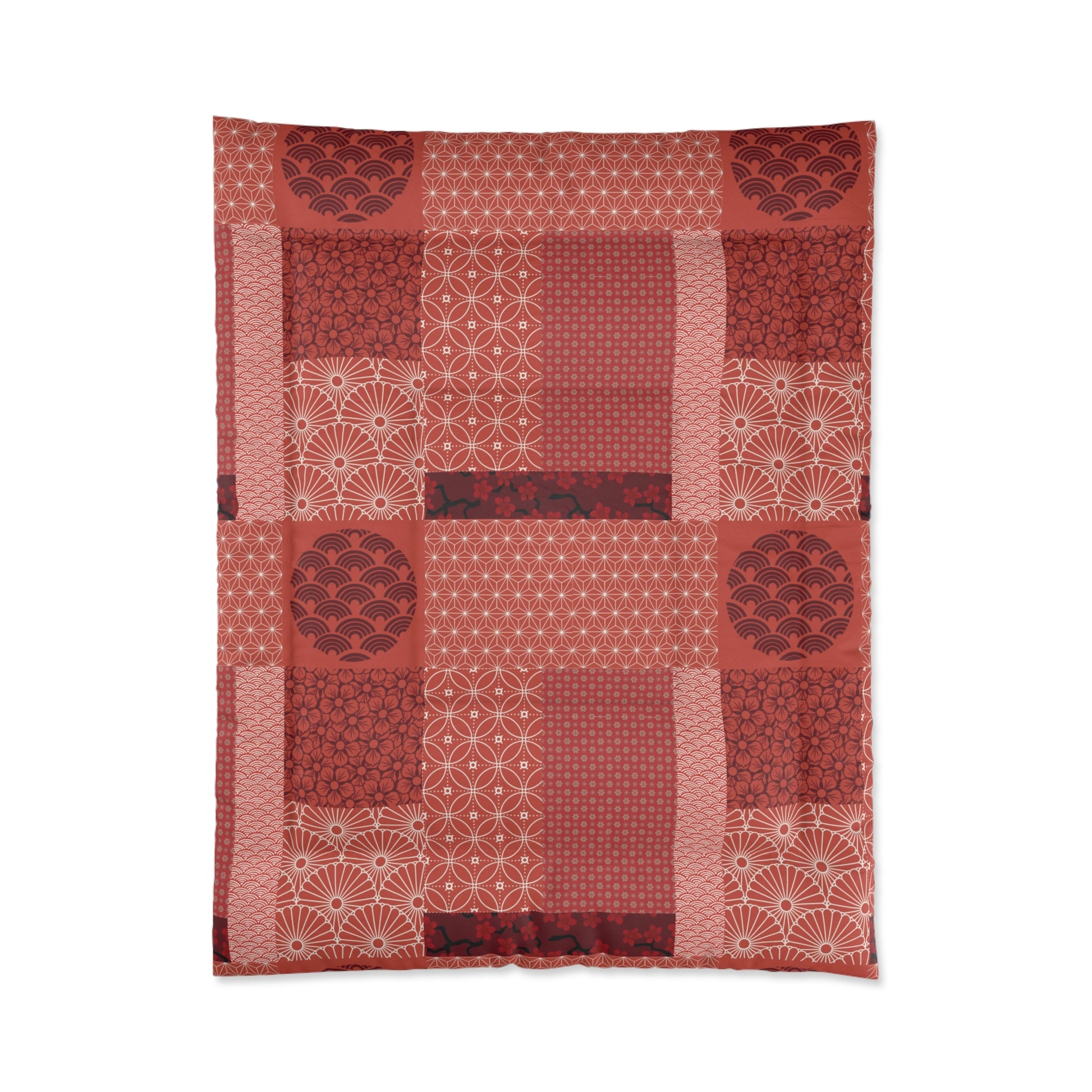 Red patterned fabric with a patchwork design on a white background