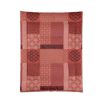 Red patterned fabric with a patchwork design on a white background