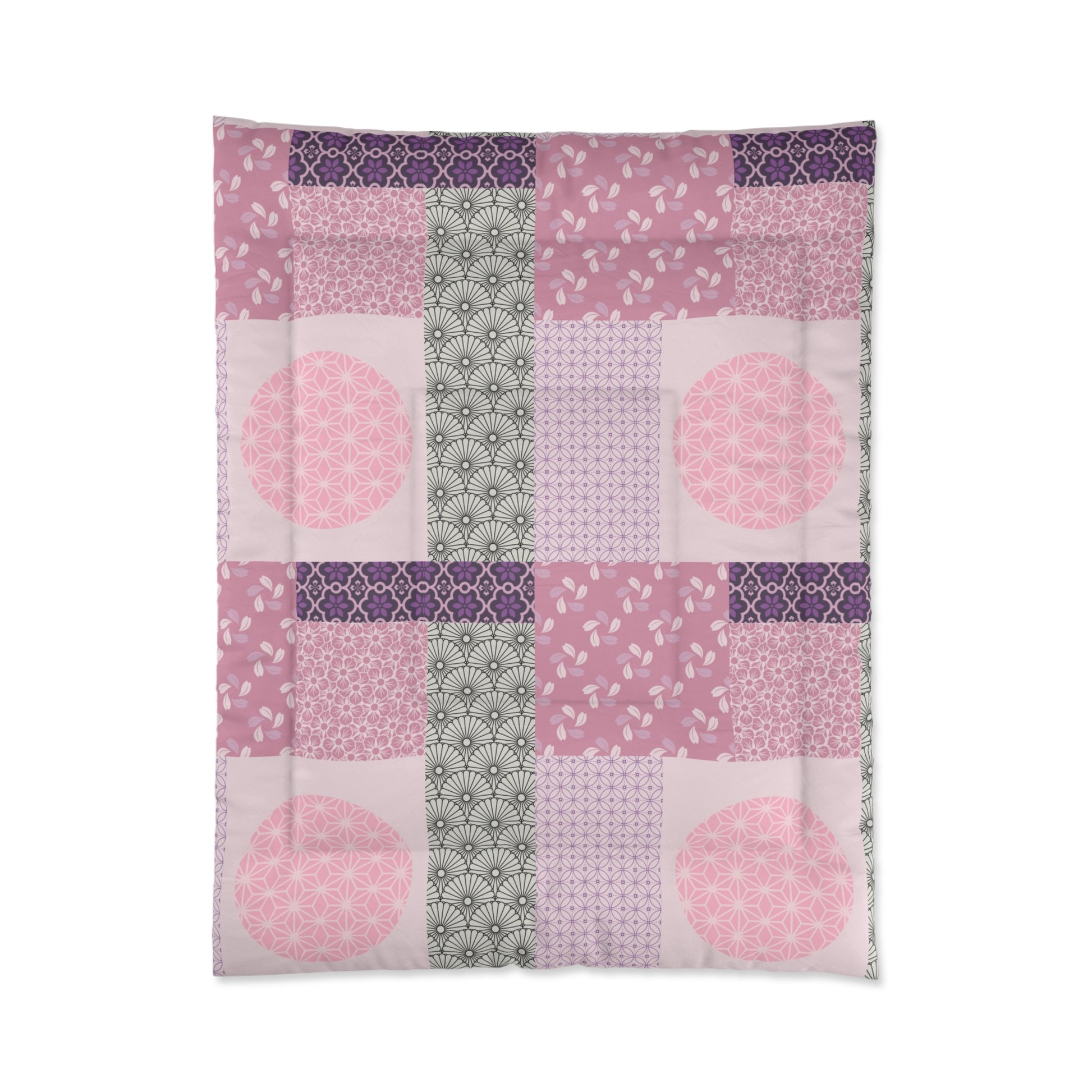 Patchwork quilt with pink and purple patterns on a white background
