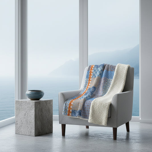 Patterned fabric with blue, orange, and gray colors on a white background