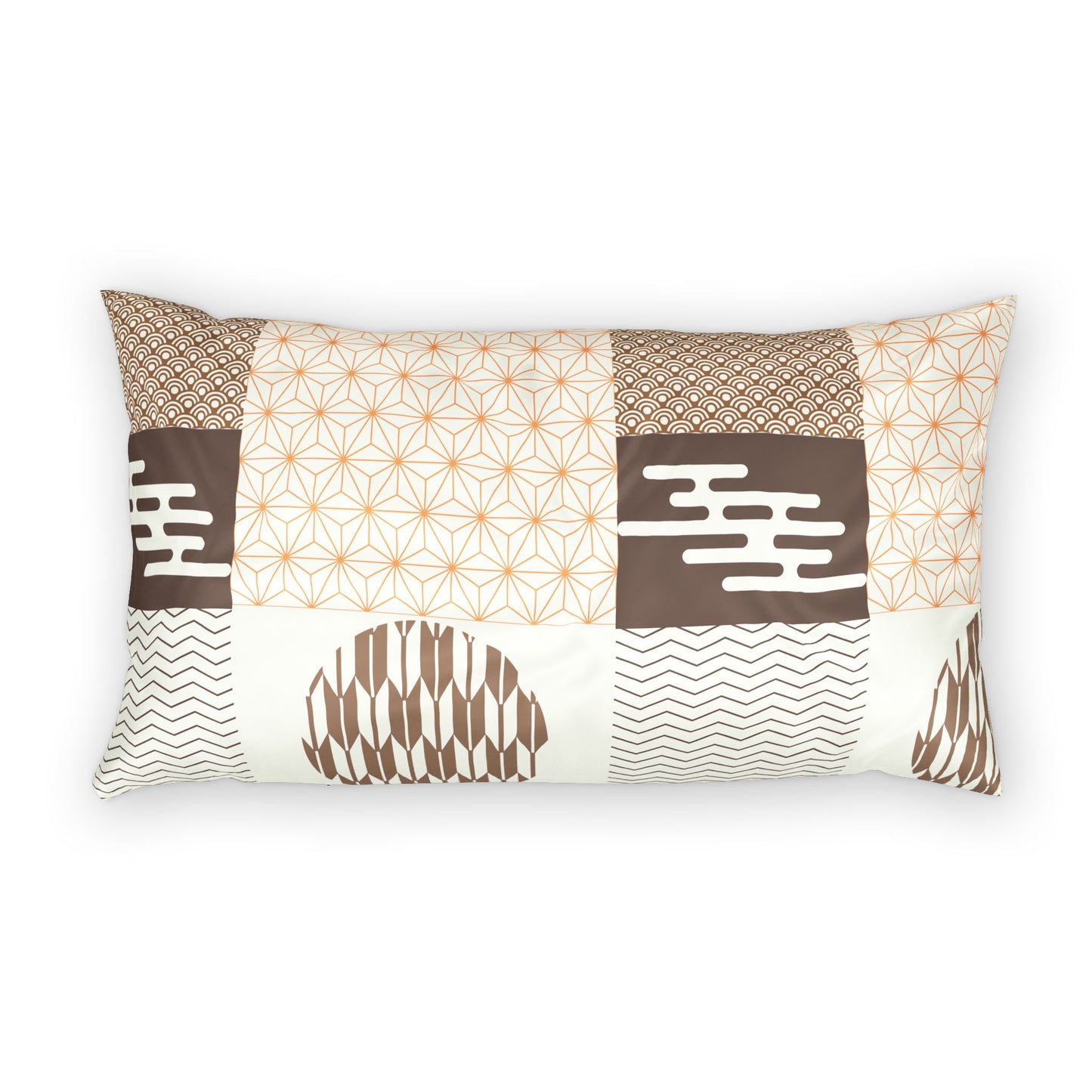 A rectangular lumbar pillow featuring a patchwork design with various geometric and tribal patterns in brown, beige, and white, set against a plain white background.