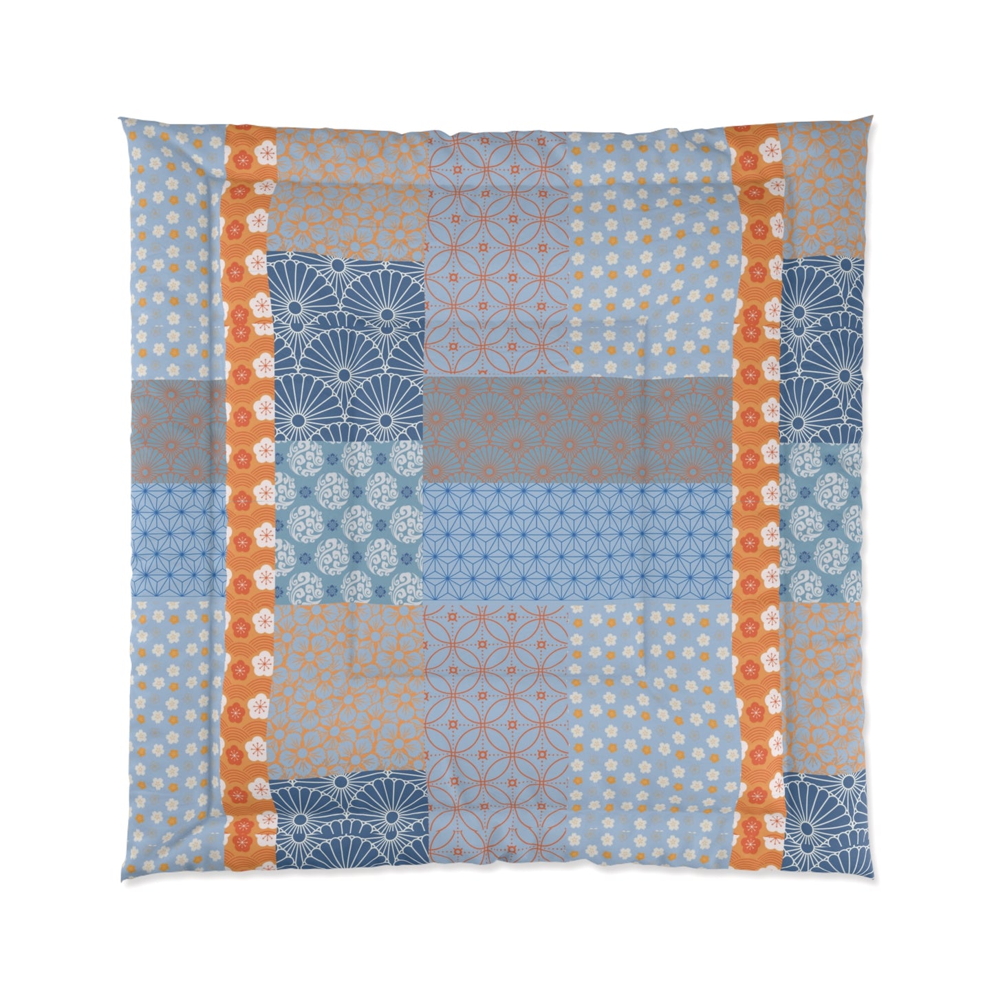 Patchwork quilt with geometric patterns in blue, orange, and gray on a white background