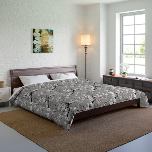 Bedroom with a bed featuring a green and red patterned comforter, wooden headboard, and white brick wall.