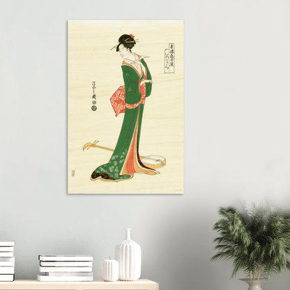 Traditional Japanese artwork of a woman in a green kimono on a beige background, displayed on a wall.