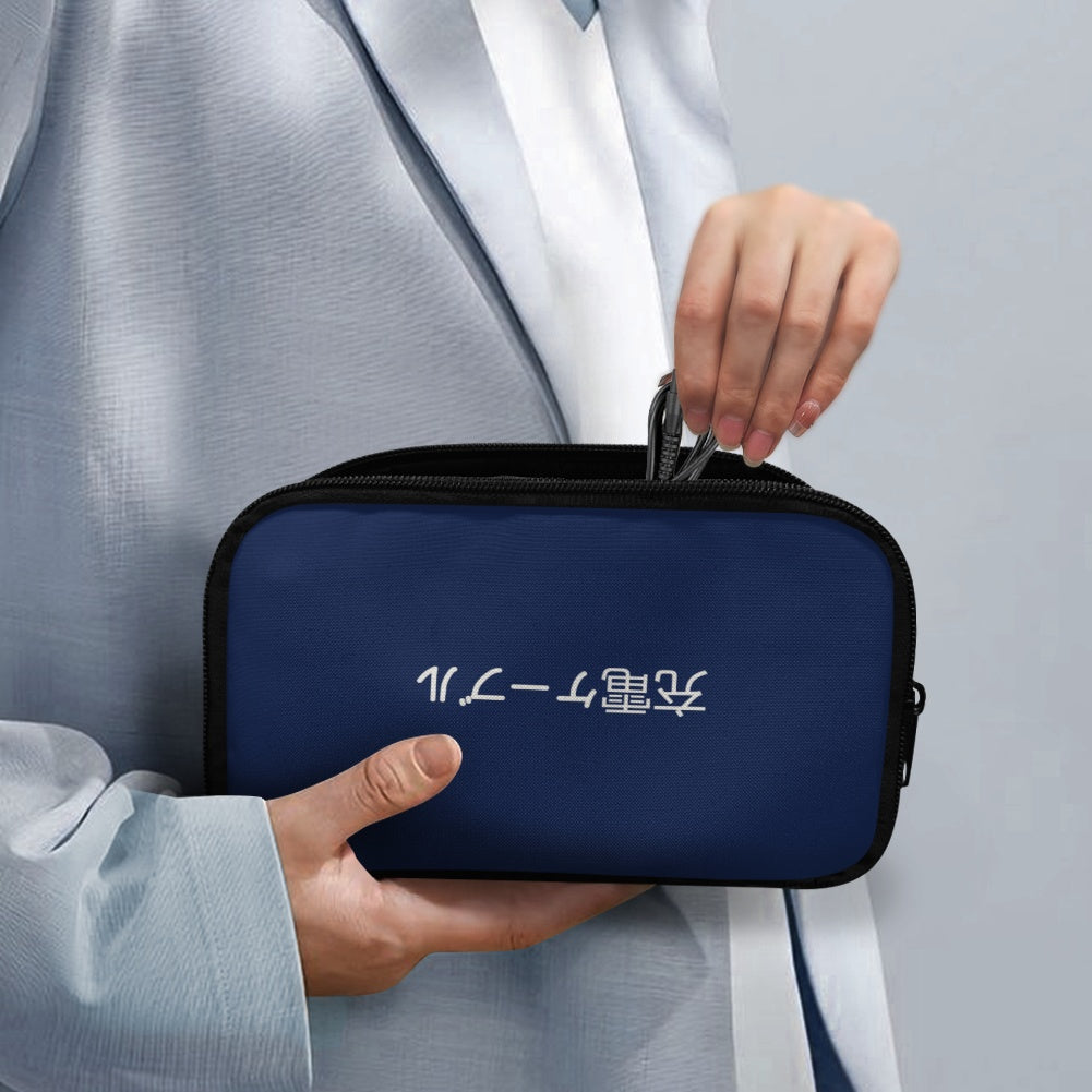 Person holding a navy blue travel case with white text on a gray background