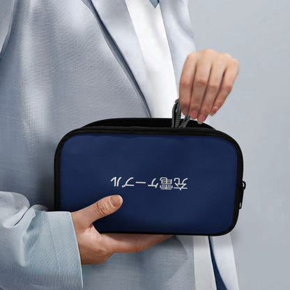 Person holding a navy blue travel case with white text on a gray background